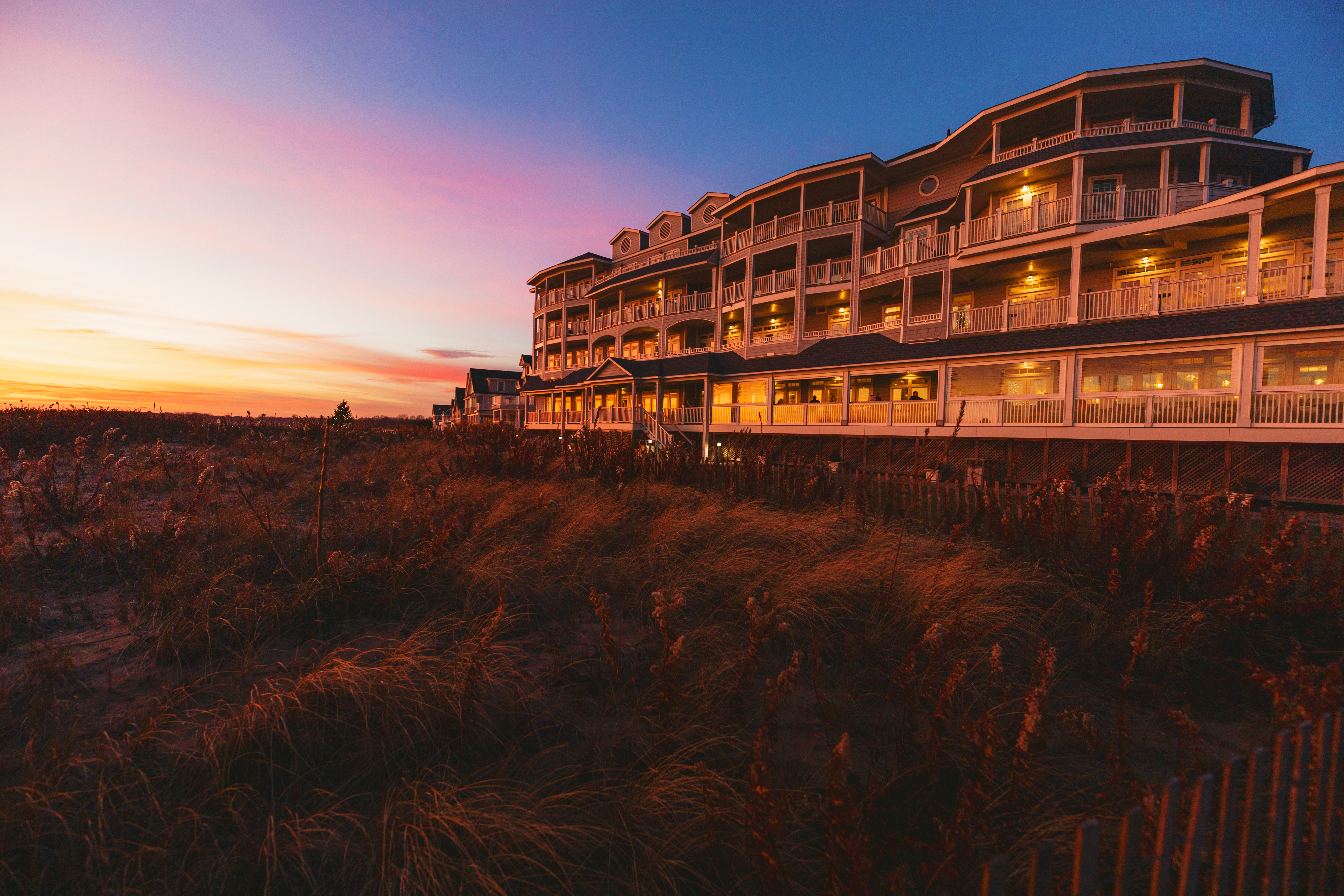 Outdoor view of Madison Beach Hotel at sunset