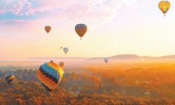 Group of hot air balloons launching in Fall Connecticut sky