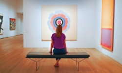 Woman enjoying a piece of art in gallery