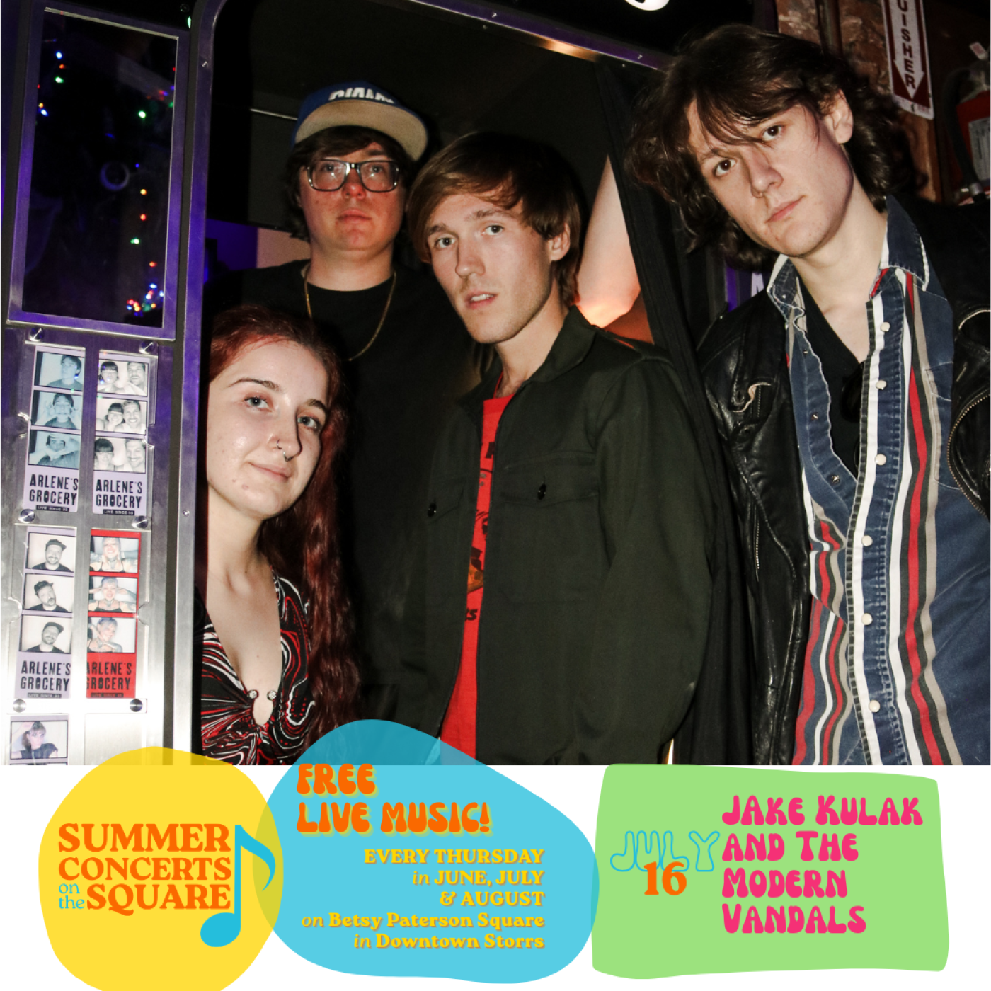 Four young people gather in and around a photo booth