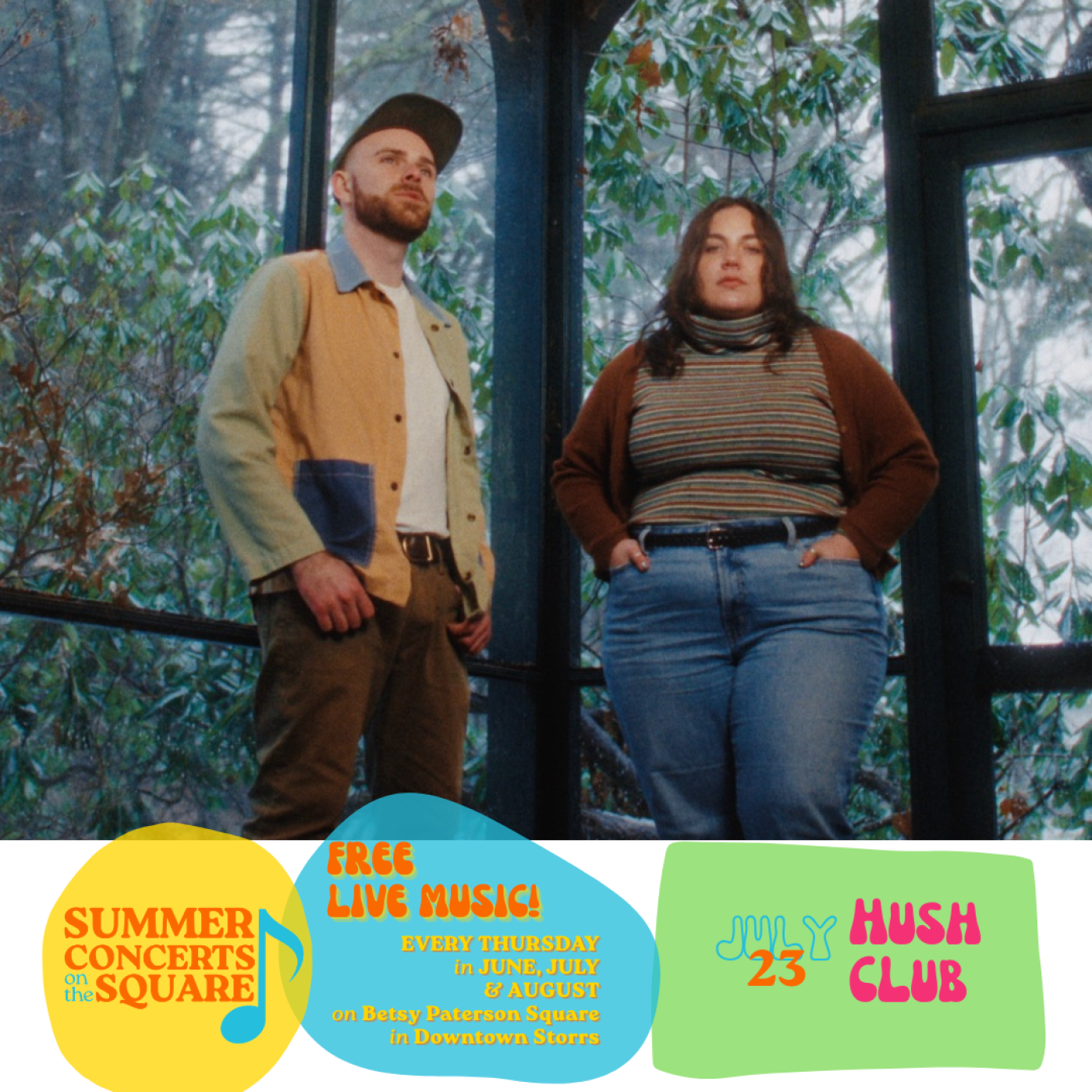 A man (left) and a woman (right) stand by windows, trees are seen beyond, it appears to be twilight