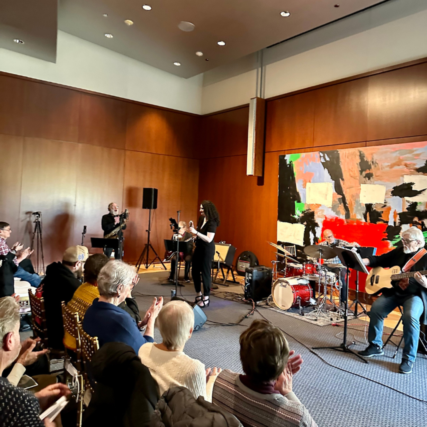 Patrons seated in front of live band 