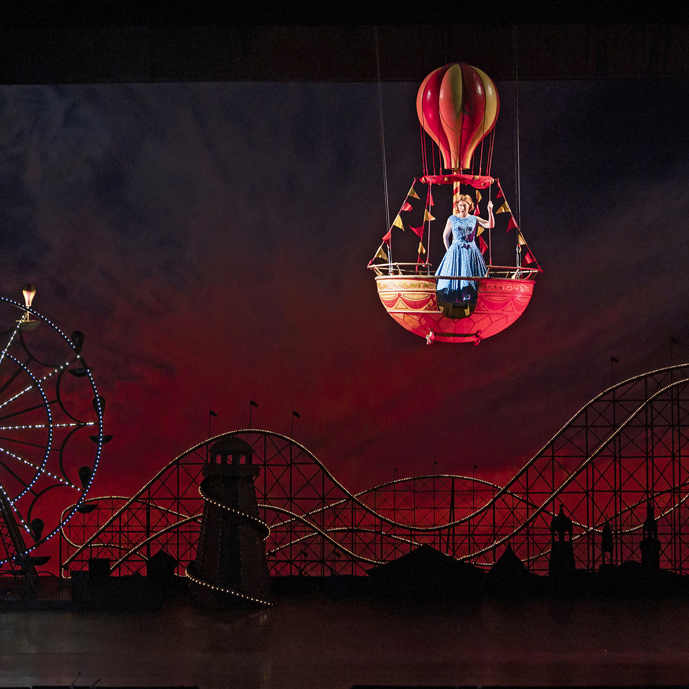 Actress floating on stage in a hot air balloon