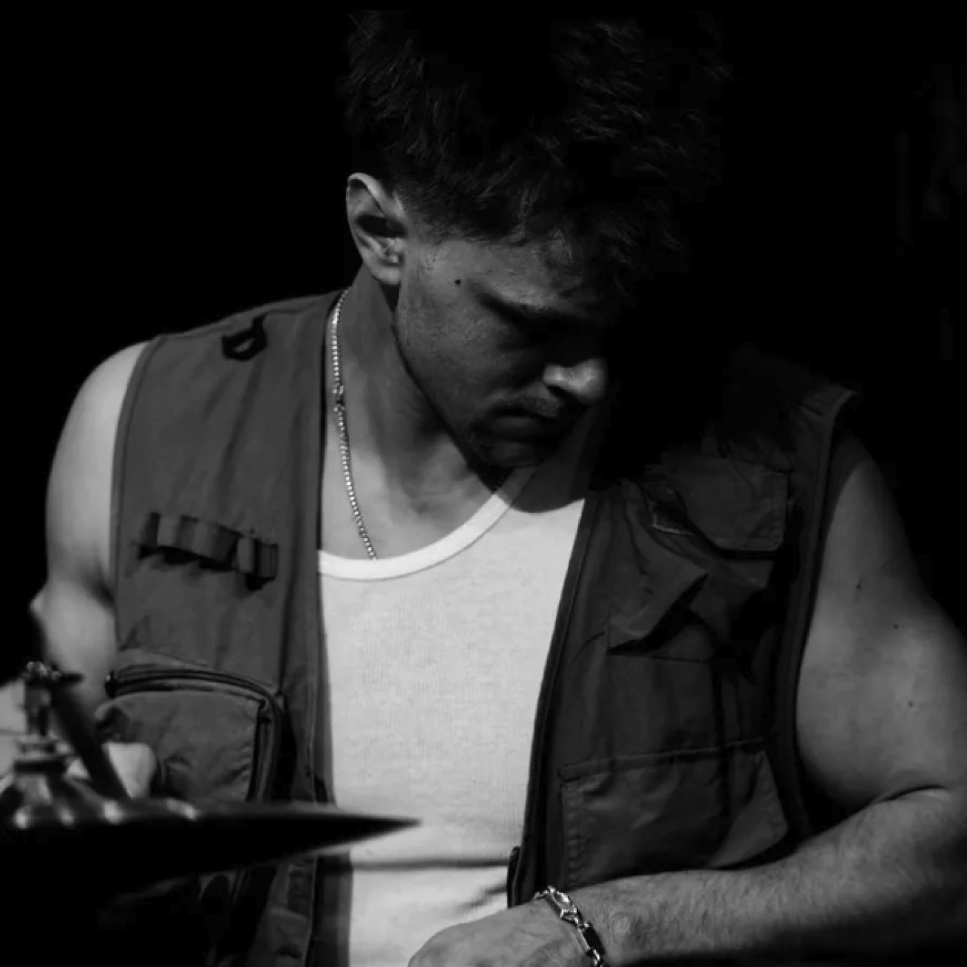 Black and white image of a male percussionist.