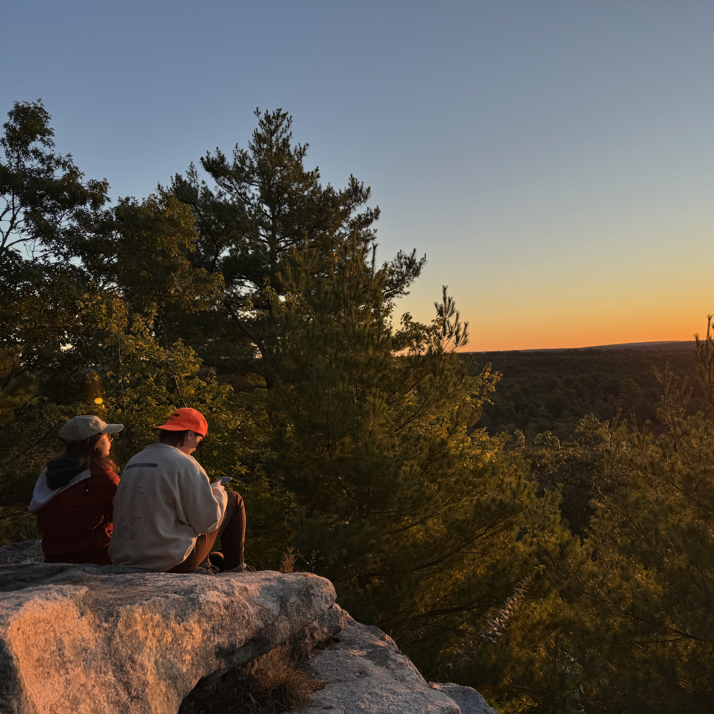 Two people watching sunrise