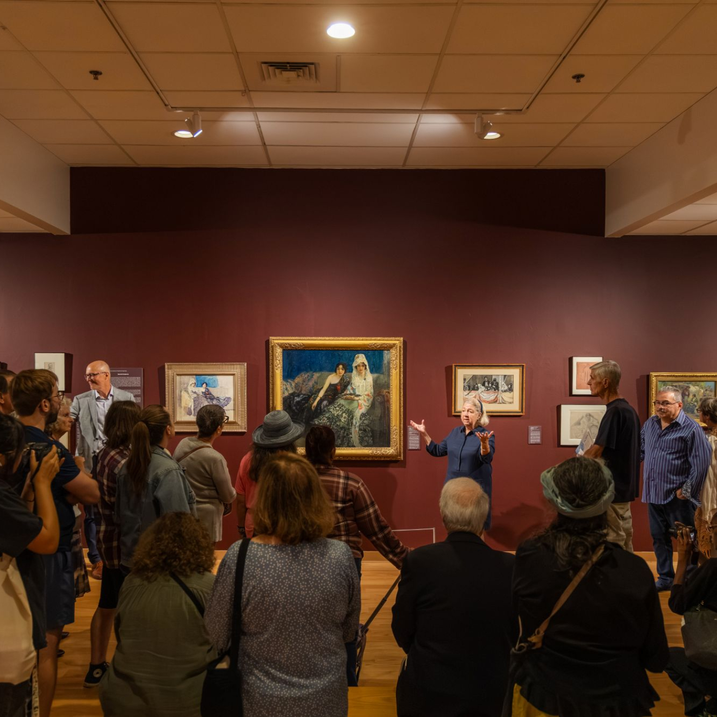 Cynthia Roznoy giving a tour in the F. Luis Mora exhibition