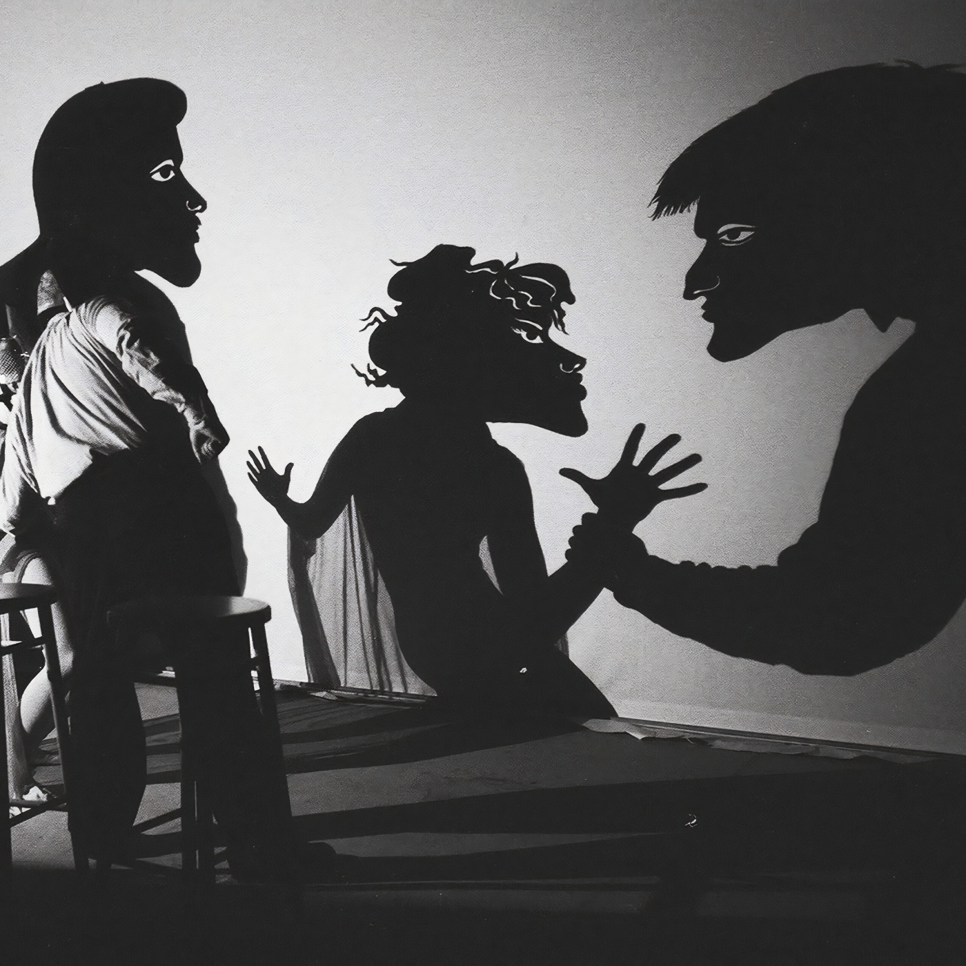 Actors performing shadow puppetry