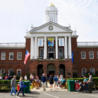 Historic Connecticut Building with clock tower and visitors outside