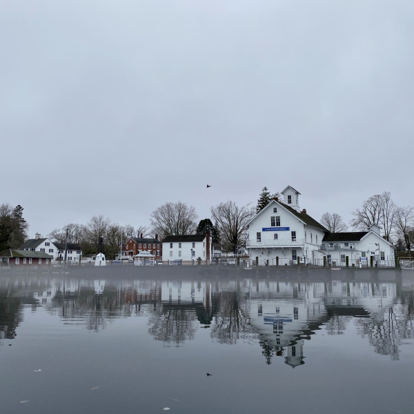 Connecticut River Museum and buildings reflected on calm river water