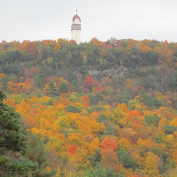 Heublein Tower overlooking colorful autumn forest in Connecticut