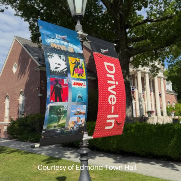 Banners on light post advertising Edmond Town Hall's Summer Drive-in movies.