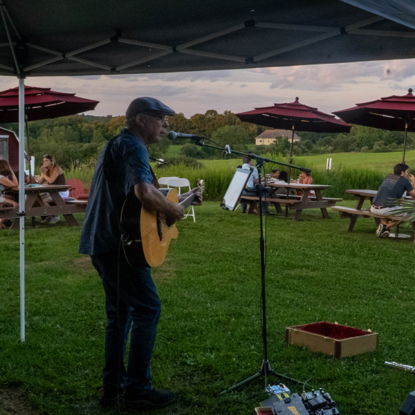 Live music being played to a group of people at our barn bar.