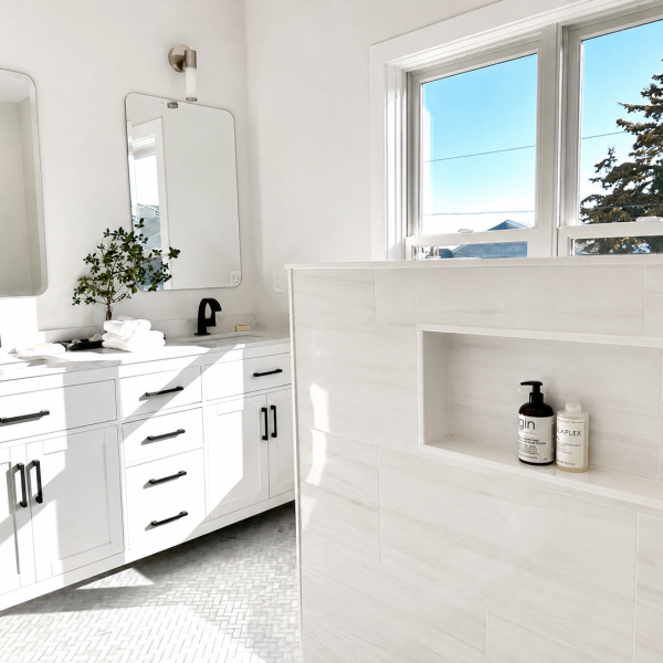 Spa-inspired primary bathroom with double vanity, oversized shower, and bright natural light.