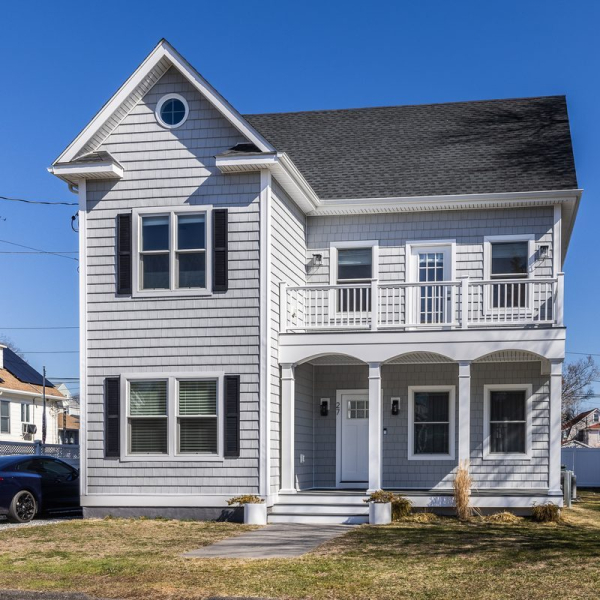 Recently built 2,600-square-foot coastal home with Trex decks, six homes from Wildemere Beach.