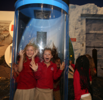 A group of kids enjoying themselves in our Hurricane Simulator on Level 6. 
