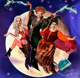 Three costumed witches pose dramatically in front of a large full moon