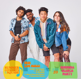 Four young people in colorful clothing stand together, smiling for the camera