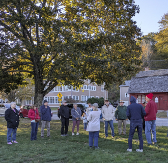 A group listening to a history talk