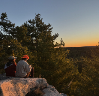 Two people watching sunrise