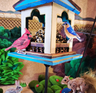 Scene of Birds and Squirrels in a Birdhouse 