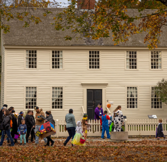 Kids trick or treating in front of the Buckingham Hall House
