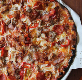 A meat covered pizza from Modern Apizza in New Haven 