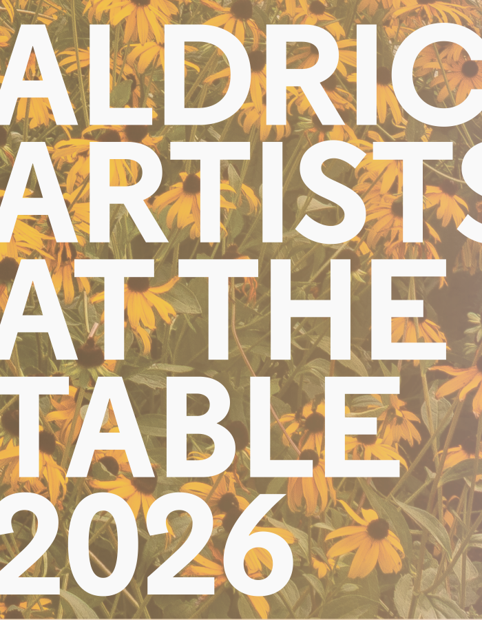 Aldrich Artists at the Table against a background of black eyed susan flowers