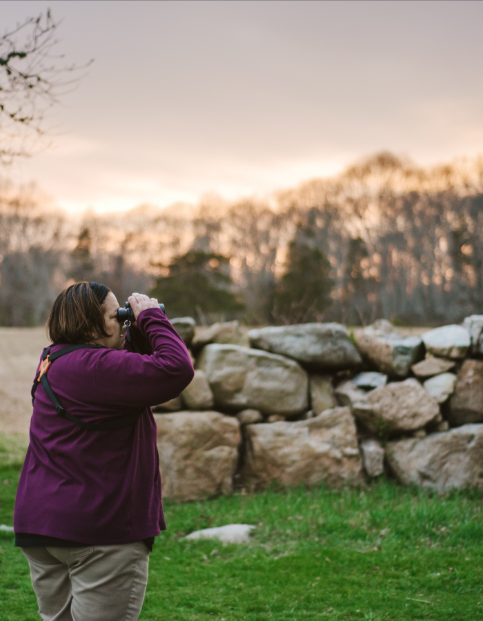 A birder looks across Haley Farm in search of birds!