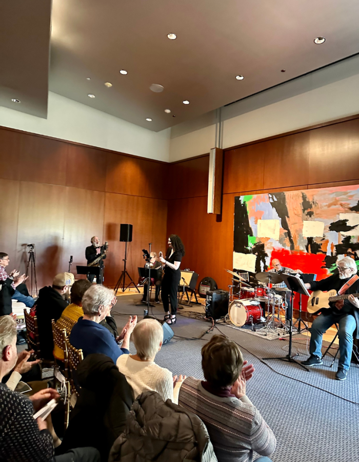 Patrons seated in front of live band 