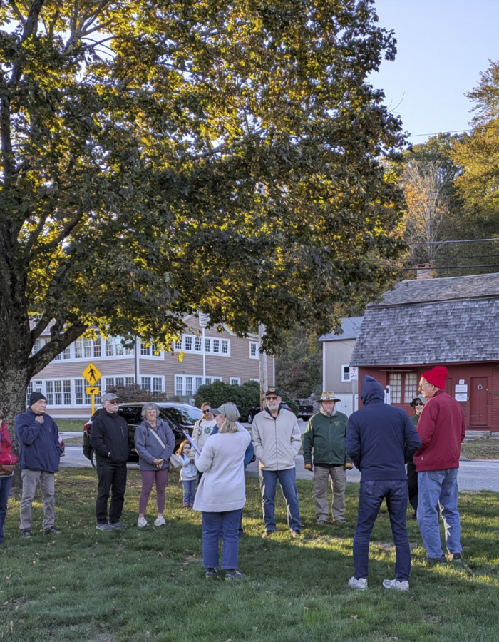 A group listening to a history talk