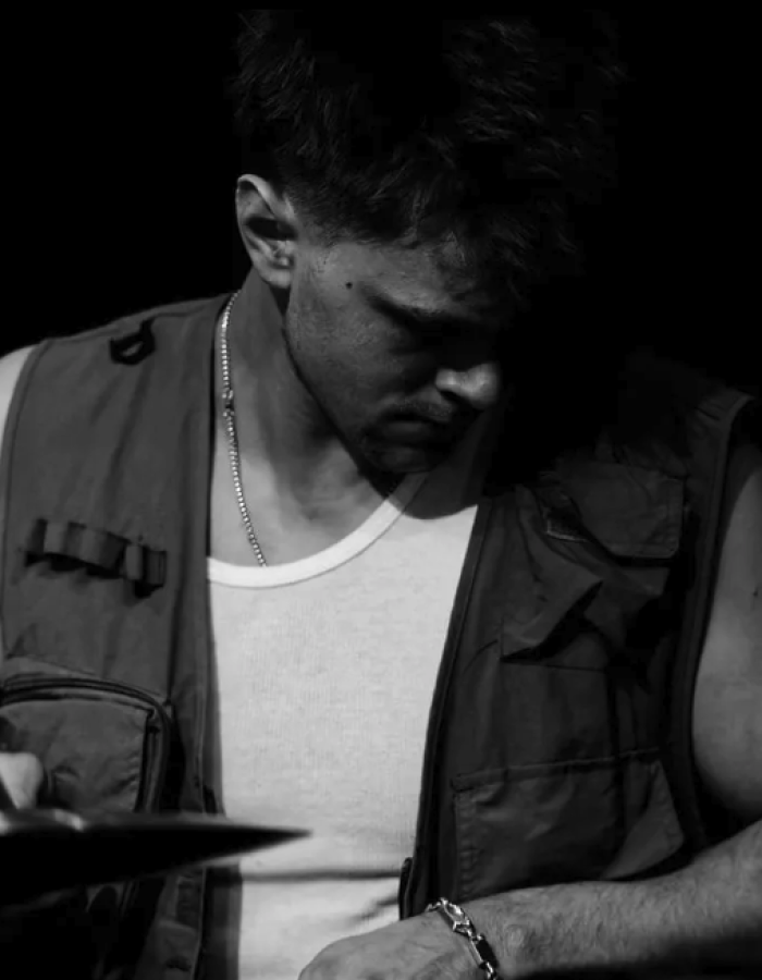 Black and white image of a male percussionist.
