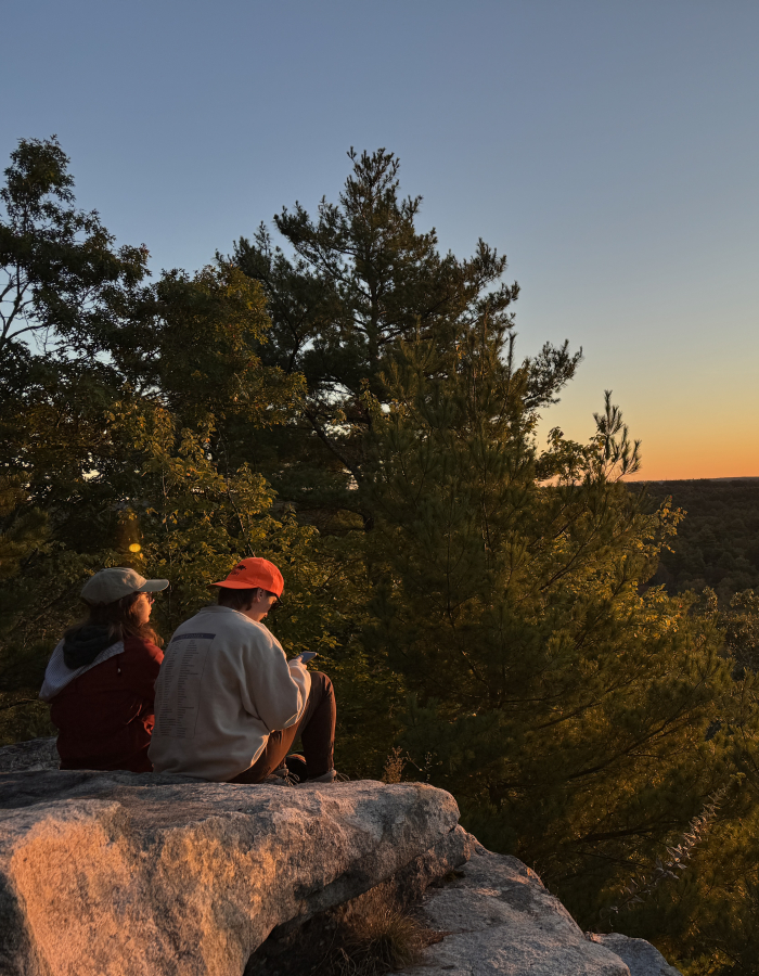 Two people watching sunrise