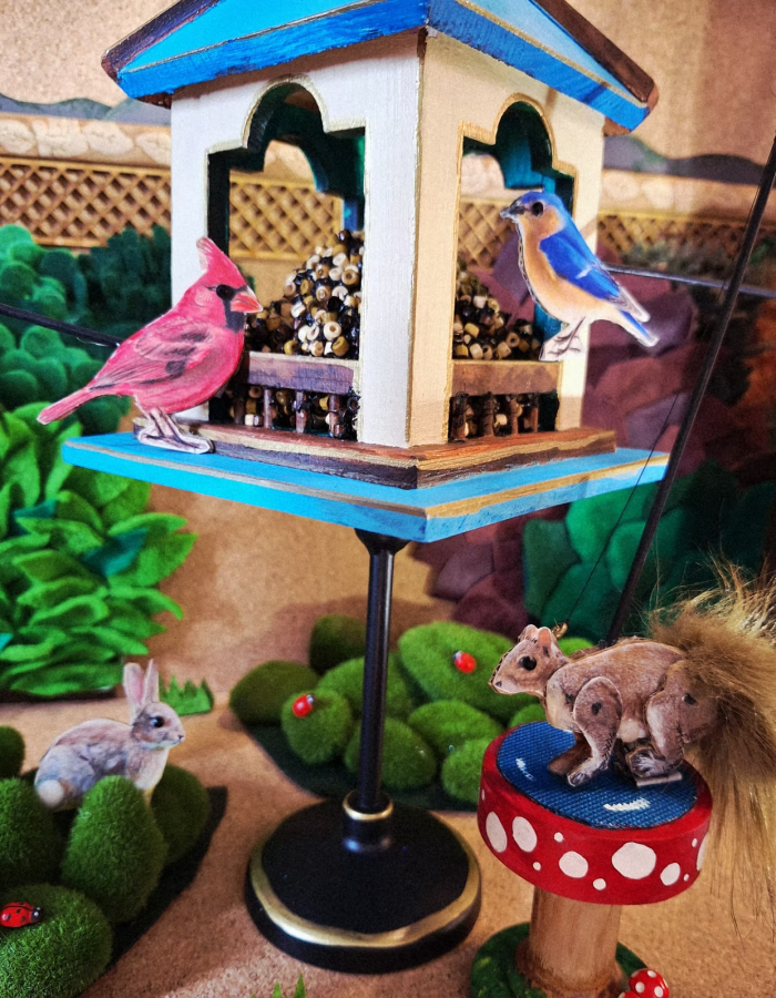 Scene of Birds and Squirrels in a Birdhouse 