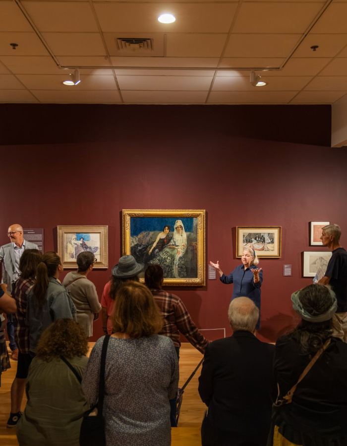 Cynthia Roznoy giving a tour in the F. Luis Mora exhibition