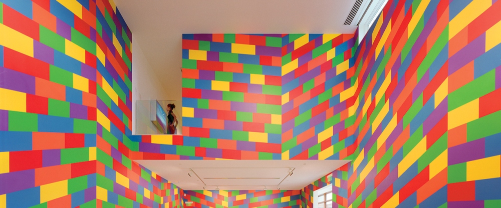 Gallery interior with colorful geometric block patterns on walls