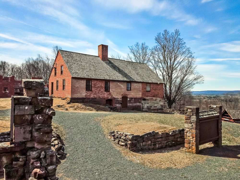 View of museum Guardhouse, a large brick structure located in the middle of the walled prison yard.
