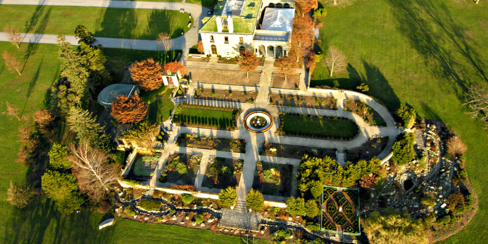 Aerial view of Harkness Estate mansion with formal gardens and fountain