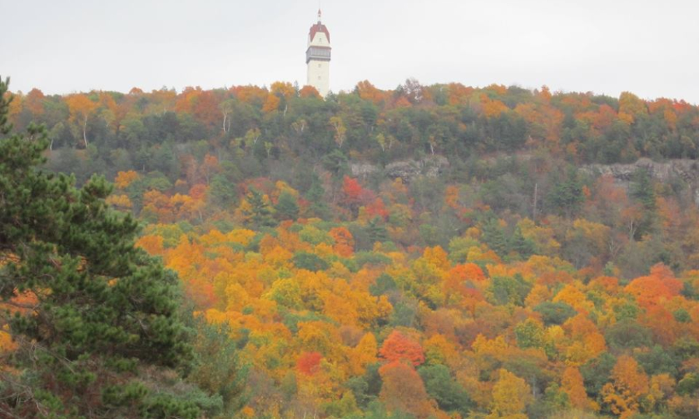 Heublein Tower overlooking colorful autumn forest in Connecticut