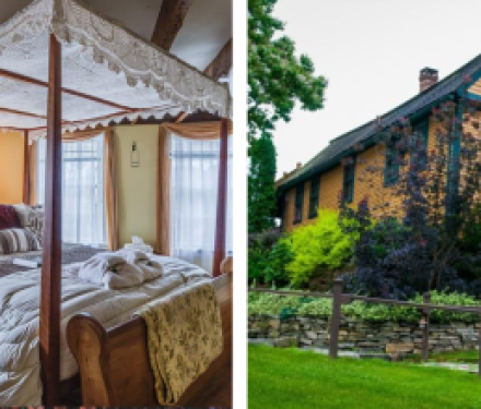 Cozy bedroom with canopy bed and yellow historic house exterior