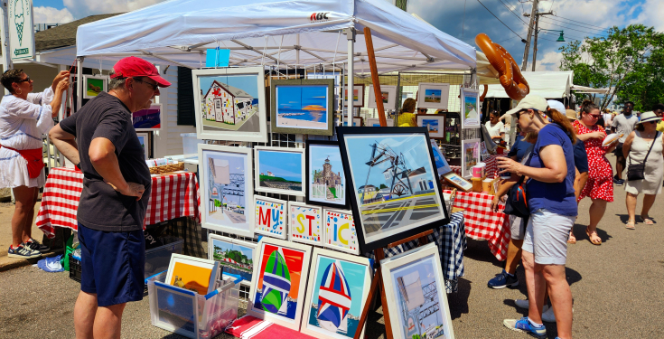 Shoppers peruse the offerings at the Mystic Art Festival 