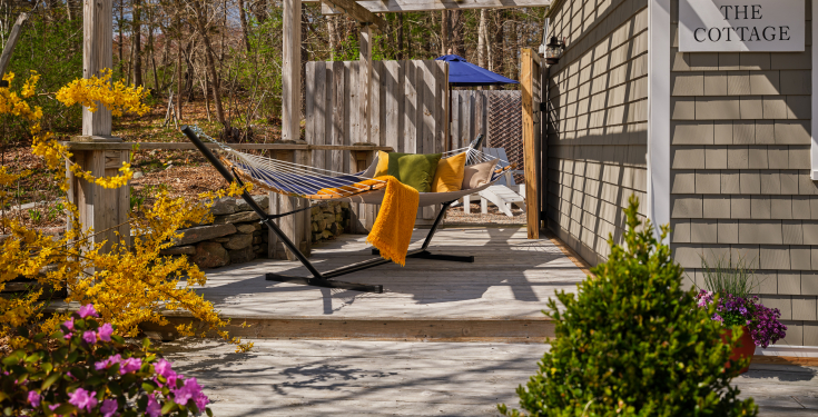 Private pet-friendly guest cottage at Abbey's Lantern Hill Inn. Relax in a private hammock at the Cottage!